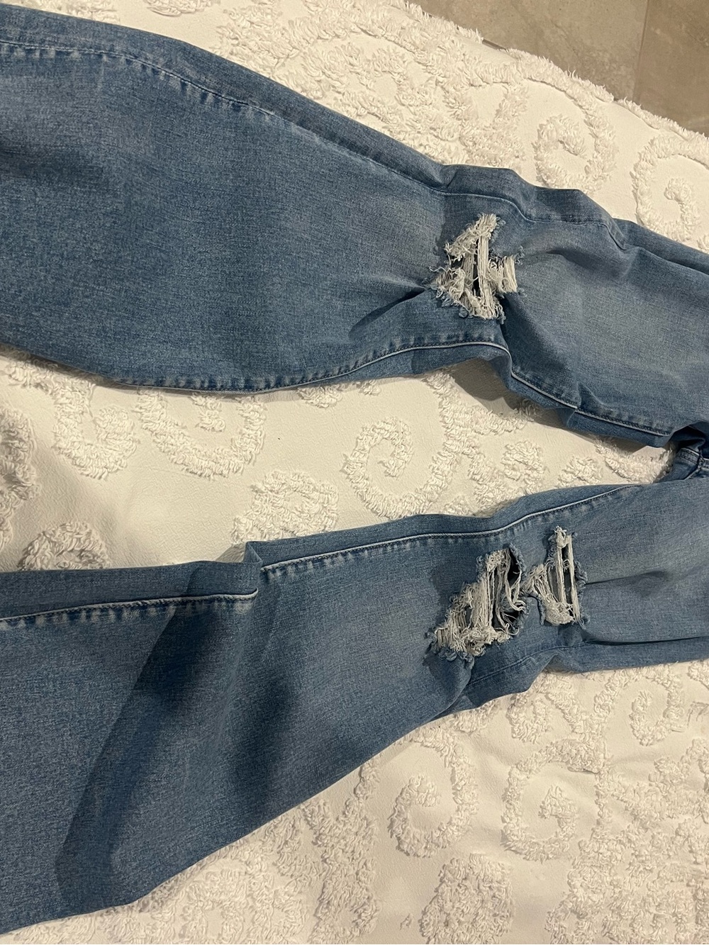 American Eagle Super High-Rise Flare Ripped Light-Wash Stretch Jeans Raw Hem